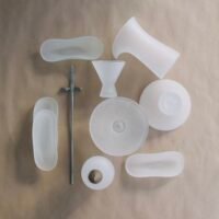 Handcrafted glass teaware by Multeo arranged for a tea ritual on a wooden table